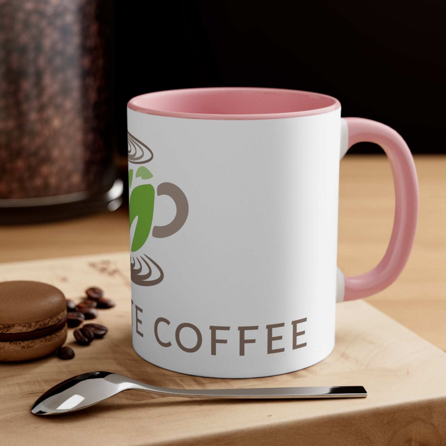 11oz  Pink Accented Marquette Coffee Logo Gift Mug with kitchen backdrop